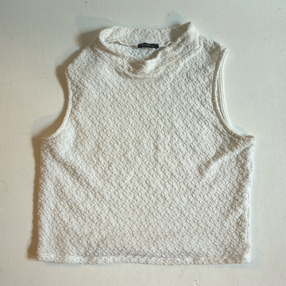 Small white sleeveless crop top